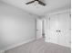 Neutral bedroom featuring carpeted floors, white trim, and a ceiling fan for comfortable living at 4605 S 150 W, Columbus, IN 47201