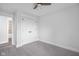 Bright bedroom boasts carpeted floors and a door leading to a bathroom, enhancing convenience at 4605 S 150 W, Columbus, IN 47201