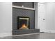 The fireplace with a dark gray brick surround and wood mantel at 4605 S 150 W, Columbus, IN 47201