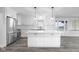 The kitchen features modern stainless steel appliances, an island, and access to the backyard at 4605 S 150 W, Columbus, IN 47201