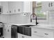 Close up of kitchen details like the stainless steel appliances and farmhouse sink at 4605 S 150 W, Columbus, IN 47201