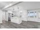 Open concept kitchen and living area with eat-in island with barstool seating at 4605 S 150 W, Columbus, IN 47201
