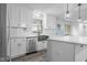 Modern kitchen boasts stainless steel appliances, shaker cabinets, and a large island with quartz countertops at 4605 S 150 W, Columbus, IN 47201