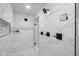 The shower features decorative tile, a rainfall shower head, and built-in shelving at 4605 S 150 W, Columbus, IN 47201