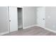 Bedroom with white sliding closet door and white doors with modern black hardware at 4625 W Naomi St, Indianapolis, IN 46241