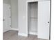 Bedroom with white sliding closet door and white doors with modern black hardware at 4625 W Naomi St, Indianapolis, IN 46241