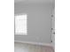 Neutral bedroom offers natural light and a white door with modern black hardware at 4625 W Naomi St, Indianapolis, IN 46241