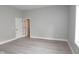 Spacious bedroom with hardwood floors, neutral walls, and natural light at 4625 W Naomi St, Indianapolis, IN 46241