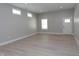 Bright living room with hardwood floors, recessed lighting, and multiple windows at 4625 W Naomi St, Indianapolis, IN 46241