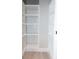 Built-in shelving unit with ample storage space and neutral wall color at 4625 W Naomi St, Indianapolis, IN 46241