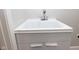 Close up of a new utility sink with white cabinets at 4625 W Naomi St, Indianapolis, IN 46241