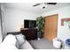 Bedroom featuring a ceiling fan, dresser with TV, house plant, and closet at 540 Cahill Ln, Indianapolis, IN 46214