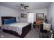 Bedroom featuring a bed with dark wooden frame, side table, and vanity at 540 Cahill Ln, Indianapolis, IN 46214