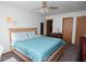 Serene main bedroom featuring a comfortable bed, ceiling fan, and neutral decor at 540 Cahill Ln, Indianapolis, IN 46214