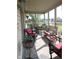 Relaxing screened porch featuring comfortable seating with a view of the lake and green spaces at 540 Cahill Ln, Indianapolis, IN 46214