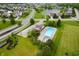 Panoramic aerial shot of community pool, lush landscaping, and surrounding neighborhood at 5576 W Glenview Dr, McCordsville, IN 46055