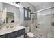 Well-lit bathroom features a tiled shower, vanity with storage, and modern fixtures at 5576 W Glenview Dr, McCordsville, IN 46055