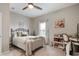 Cozy bedroom with a metal bed frame, neutral tones, and a convenient desk area at 5576 W Glenview Dr, McCordsville, IN 46055