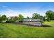 Community entrance with the sign 'Emerald Springs' set against a backdrop of lush greenery at 5576 W Glenview Dr, McCordsville, IN 46055