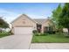 Charming brick home featuring a well-manicured lawn, attached two car garage, and a welcoming front entrance at 5576 W Glenview Dr, McCordsville, IN 46055