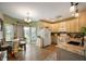 Bright kitchen with updated appliances, granite countertops, and an adjacent dining area with sliding door to patio at 5576 W Glenview Dr, McCordsville, IN 46055