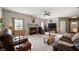 Cozy living room featuring neutral paint, plush carpet, with ample seating perfect for relaxation and entertainment at 5576 W Glenview Dr, McCordsville, IN 46055