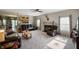 Comfortable living space with a neutral color palette, plush carpet, and an inviting layout to the open kitchen at 5576 W Glenview Dr, McCordsville, IN 46055