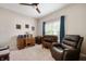 Inviting office with a recliner, desk, and electronic keyboard at 5576 W Glenview Dr, McCordsville, IN 46055