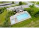 Aerial view of the community pool and surrounding area with ample seating and a hot tub at 5576 W Glenview Dr, McCordsville, IN 46055