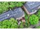 Aerial view of townhouses with black roofs and lush greenery, creating a serene atmosphere at 558 E Vermont St, Indianapolis, IN 46202
