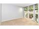 Bright bedroom with large windows and neutral carpet at 558 E Vermont St, Indianapolis, IN 46202