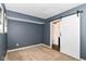 Carpeted bedroom with ensuite bathroom featuring white sliding barn door at 558 E Vermont St, Indianapolis, IN 46202