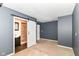This is a view of a carpeted bedroom with a barn door to the Primary bath at 558 E Vermont St, Indianapolis, IN 46202