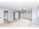 Expansive main bedroom with plush carpet, ceiling fan, natural light, and multiple doors at 558 E Vermont St, Indianapolis, IN 46202