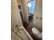 Bathroom view featuring a toilet, tiled shower with bathtub, and a single sink vanity at 5711 Bradston Way, Indianapolis, IN 46237