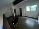 Spacious bedroom with a modern chair, plenty of natural light, and an en suite bathroom at 5711 Bradston Way, Indianapolis, IN 46237