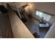 Bright interior view of stairs, carpeted floor, and a window with natural light at 5711 Bradston Way, Indianapolis, IN 46237