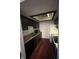 Kitchen with dark cabinets, wood countertops, and appliances at 5711 Bradston Way, Indianapolis, IN 46237