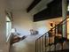Spacious living room with high ceilings, a staircase, and carpet flooring at 5711 Bradston Way, Indianapolis, IN 46237