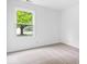 Cozy bedroom featuring plush carpeting and a large window at 6011 Twyckenham Dr, Indianapolis, IN 46236