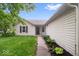 Charming single-story home featuring a well-kept lawn, and tasteful landscaping at 6011 Twyckenham Dr, Indianapolis, IN 46236