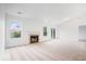 Inviting living room with neutral carpet, a fireplace, and a sliding glass door at 6011 Twyckenham Dr, Indianapolis, IN 46236