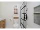 Elegant bathroom boasting a glass shower, modern fixtures, and bright white tiles at 611 N Park Ave # 108, Indianapolis, IN 46204
