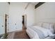 Bright bedroom includes laundry, light wood floors, and simple decor at 611 N Park Ave # 108, Indianapolis, IN 46204