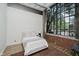 Cozy bedroom with a large window and exposed brick, offering natural light at 611 N Park Ave # 108, Indianapolis, IN 46204