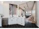 Open concept kitchen showcasing white cabinetry, stainless appliances, and view to the living room at 611 N Park Ave # 108, Indianapolis, IN 46204