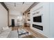 Stylish living area with fireplace, TV, and combined kitchen and dining area at 611 N Park Ave # 108, Indianapolis, IN 46204