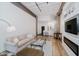 Modern living room features an open floor plan and a cozy fireplace at 611 N Park Ave # 108, Indianapolis, IN 46204