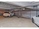 Spacious underground parking garage showcasing parking spaces and vehicle at 611 N Park Ave # 108, Indianapolis, IN 46204