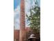 Exterior view of a smokestack made of brick, architectural detail, and sky background at 611 N Park Ave # 108, Indianapolis, IN 46204